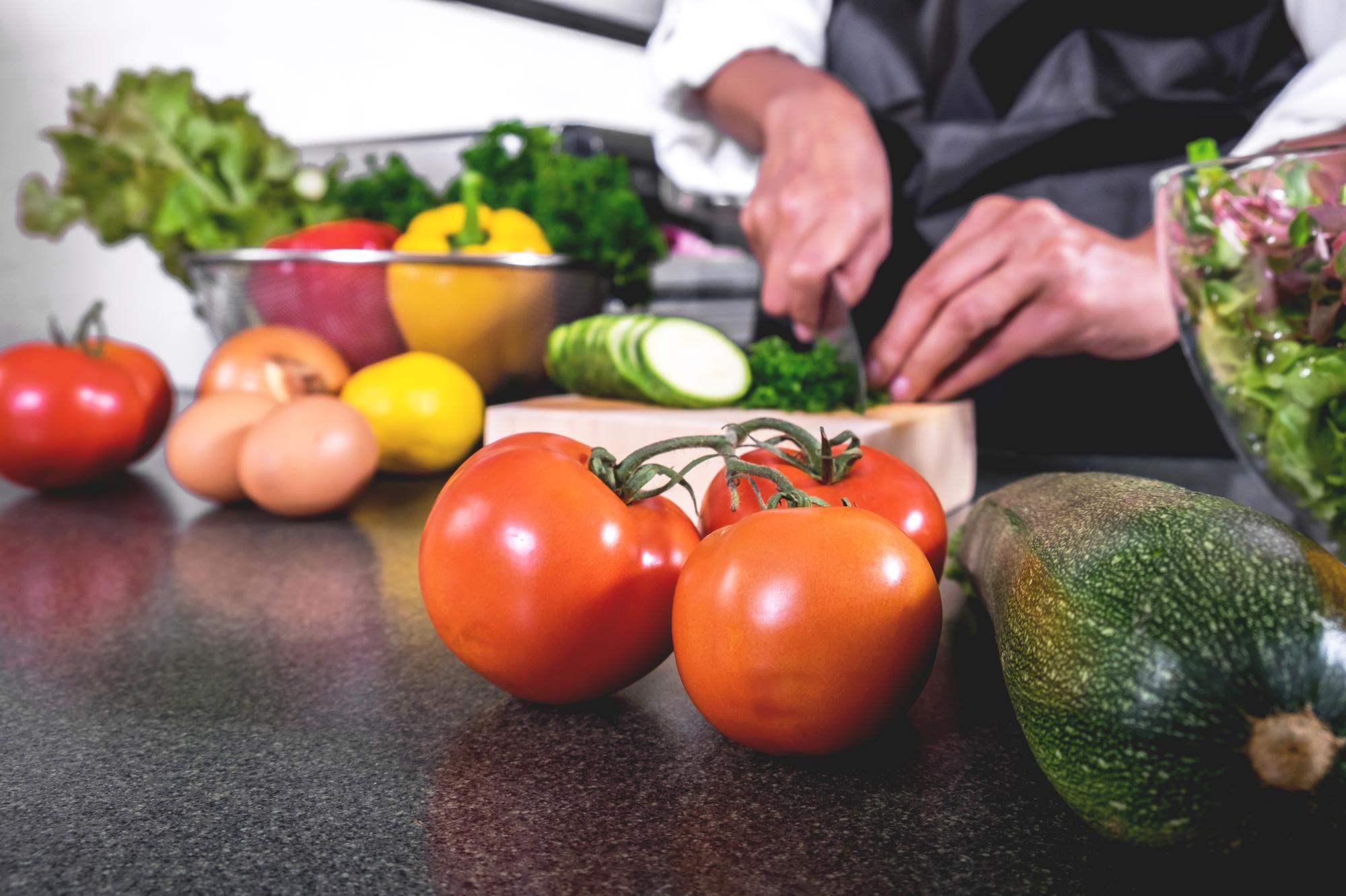 Workshop countertop with fresh vegetables and tools