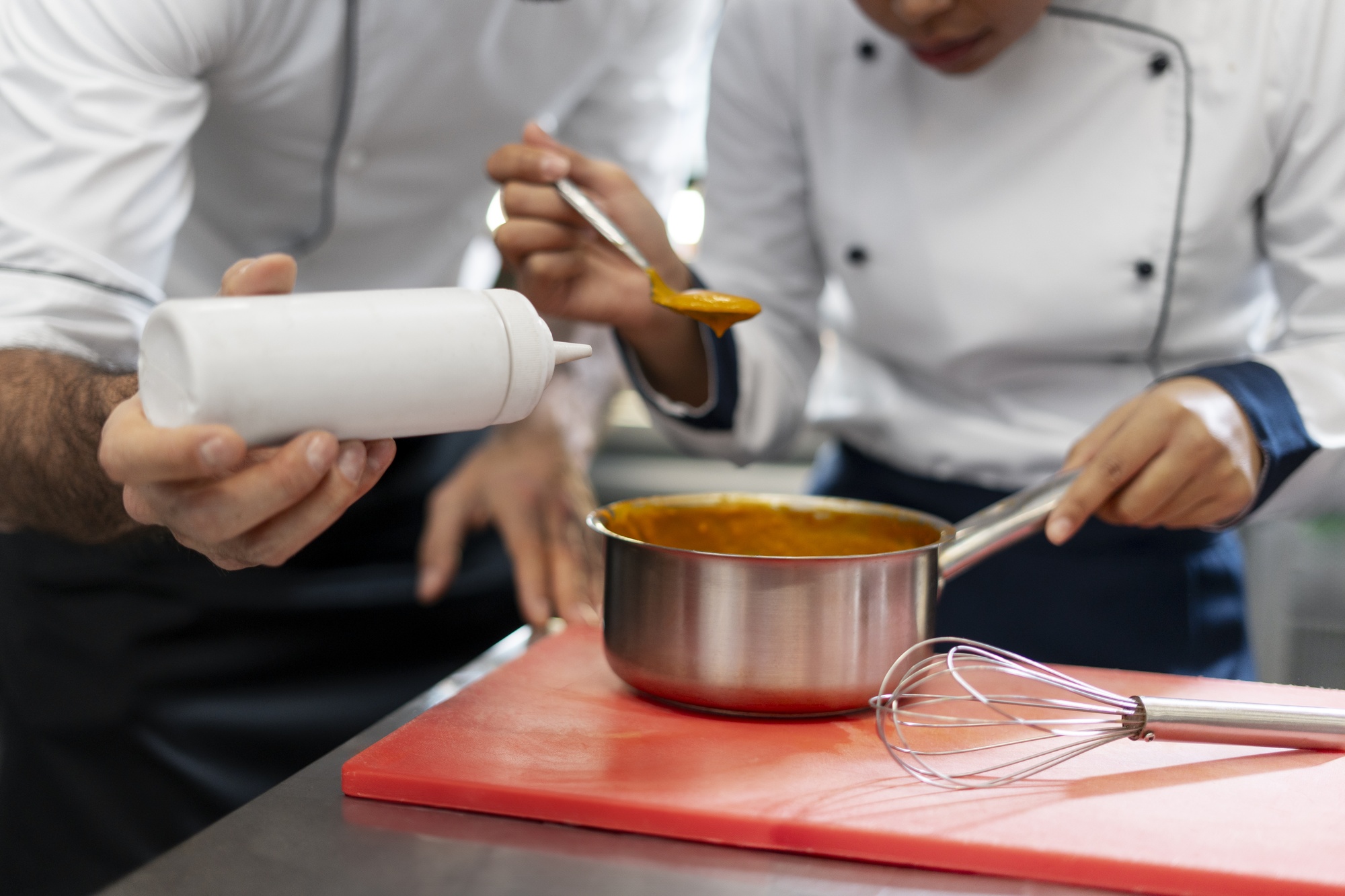 Instructor demonstrating sauce technique